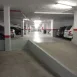 Parking de comunidad en Sevilla con pintura renovada y señalización horizontal recién aplicada.